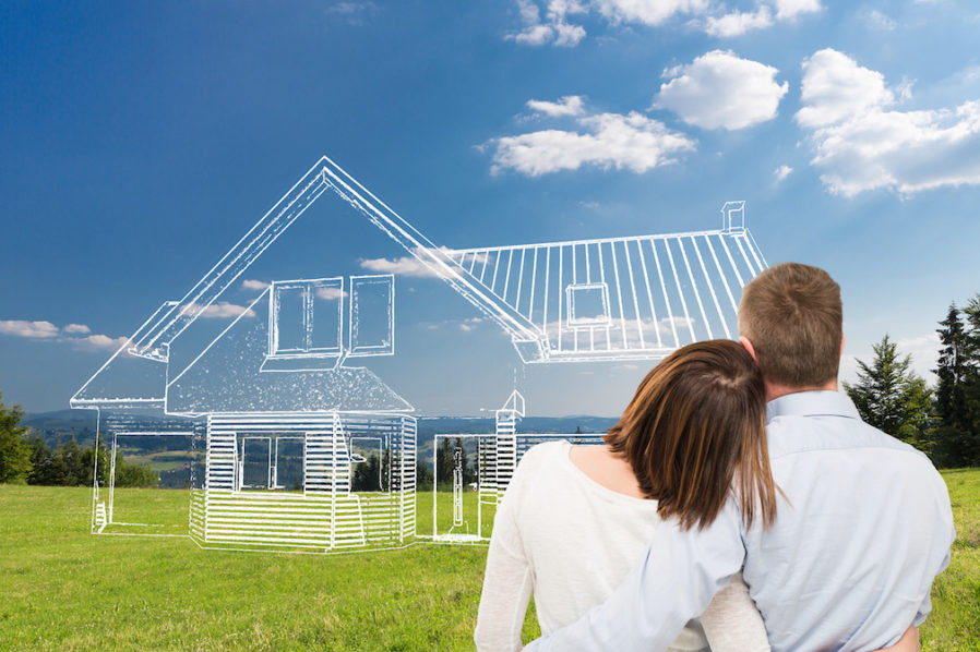 Young couple looking at dream house.