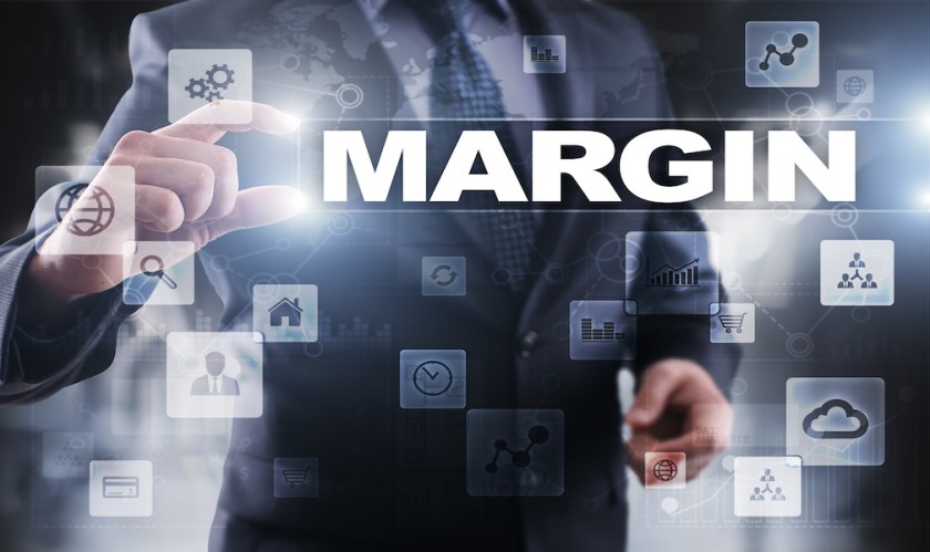 Businessman selecting margin on virtual screen.