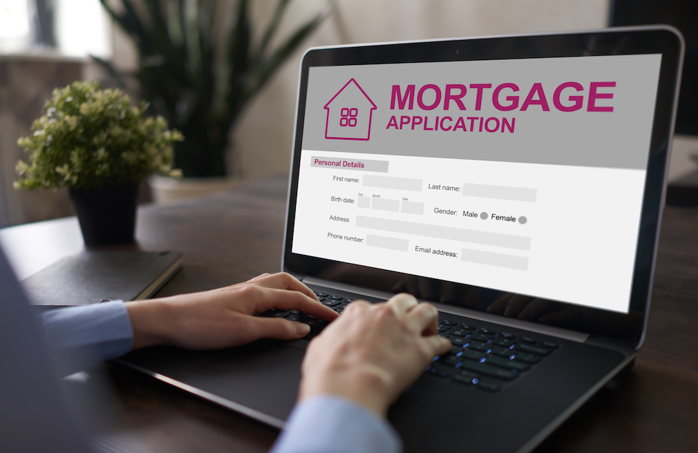 Online mortgage application on screen. Property loan. Business and financial concept.