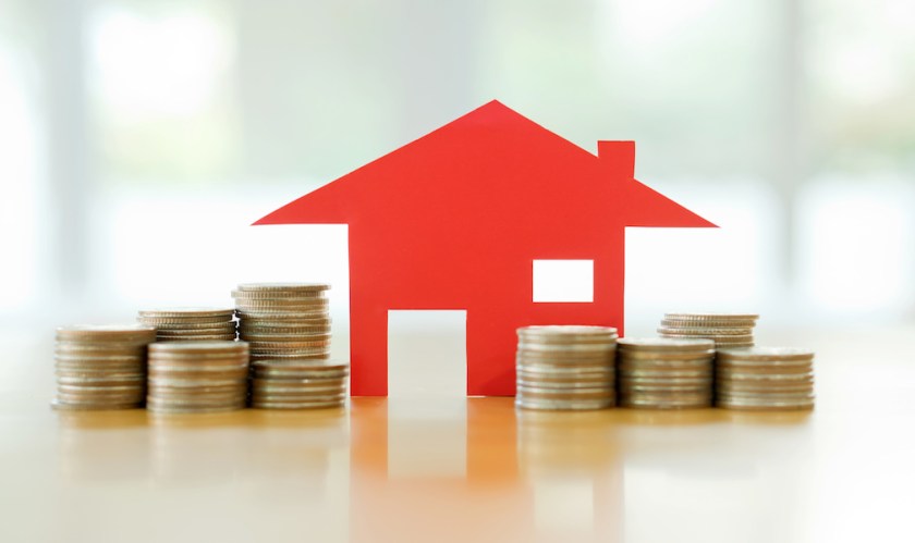Mortgage concept by money house from the coins