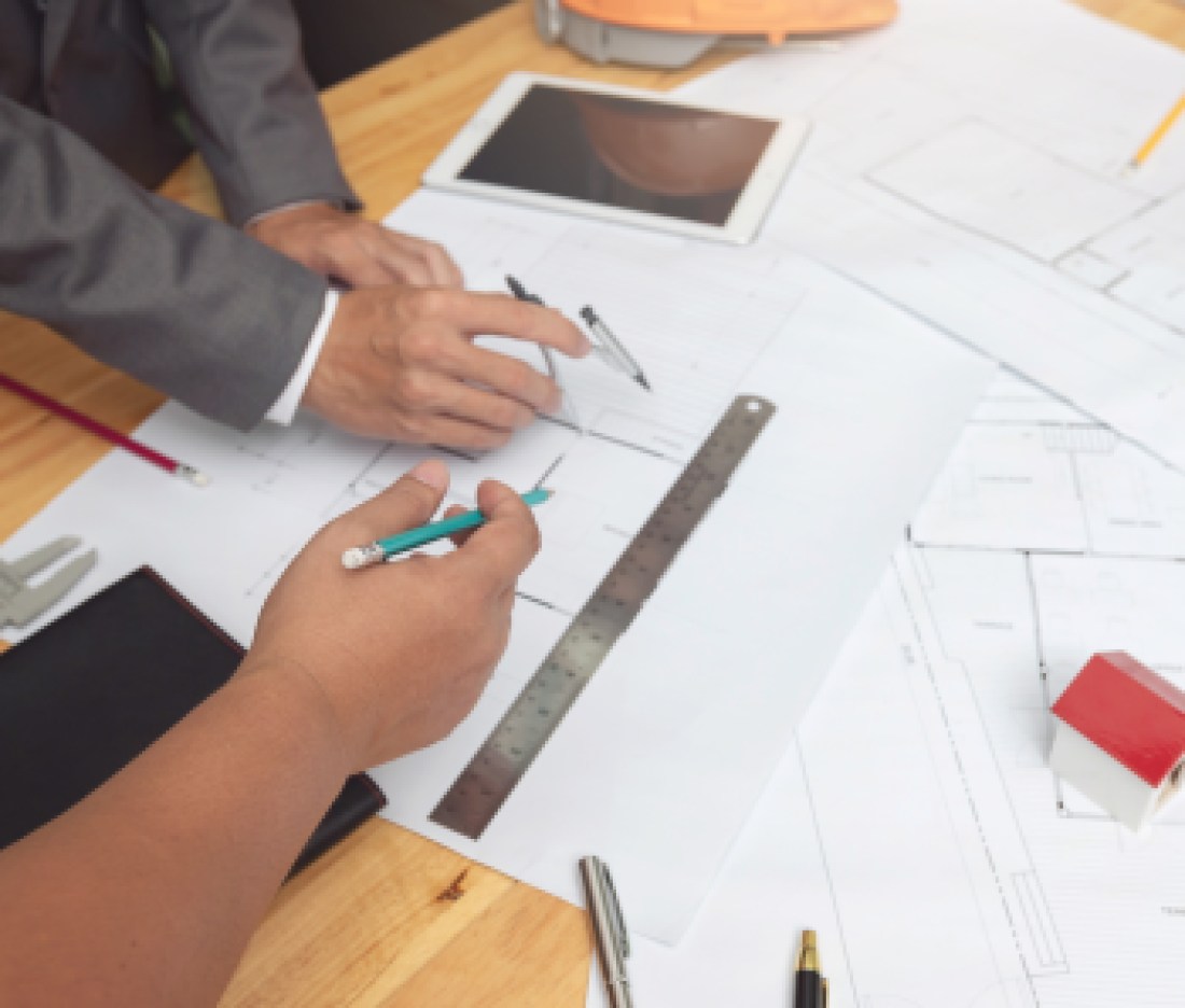 Engineer and Architect concept, Engineer Architects and real estate agent office team working with blueprints