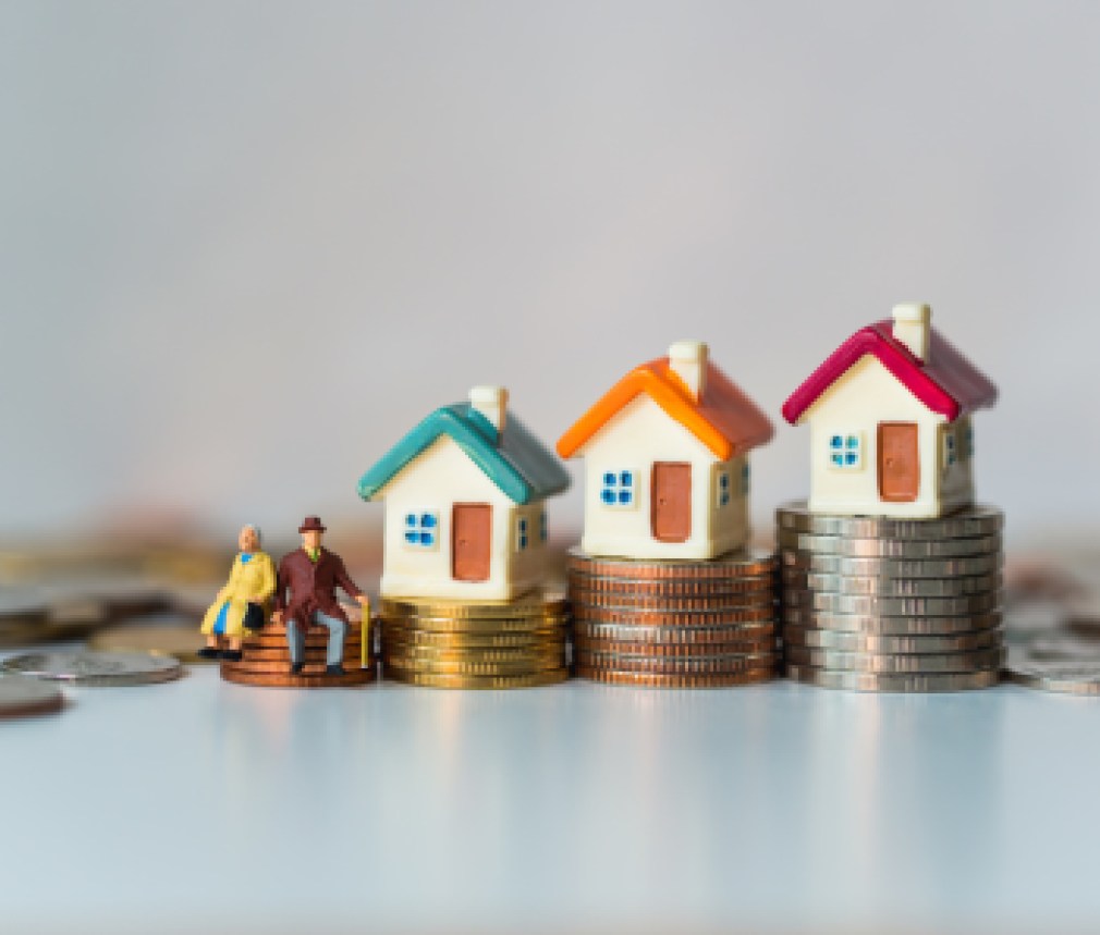 Miniature elderly people sitting on stack coins and mini house using as job retirement, business and insurance concept