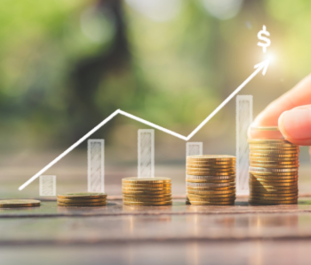 loan investment residential building house, real estate, property, mortgage concept. hand put coin stacking on wood table in green park background. startup graph growth up wealth.ESG.financial saving.