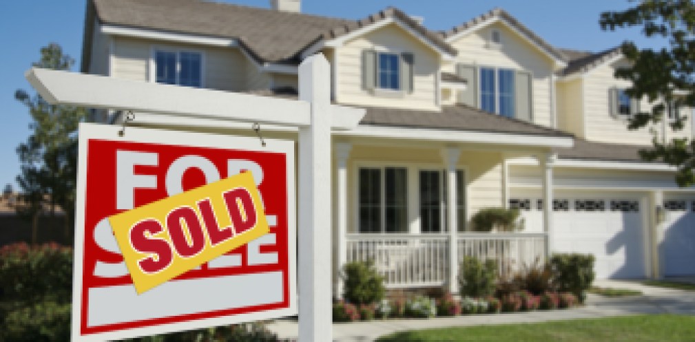 Sold Home For Sale Sign in Front of New House