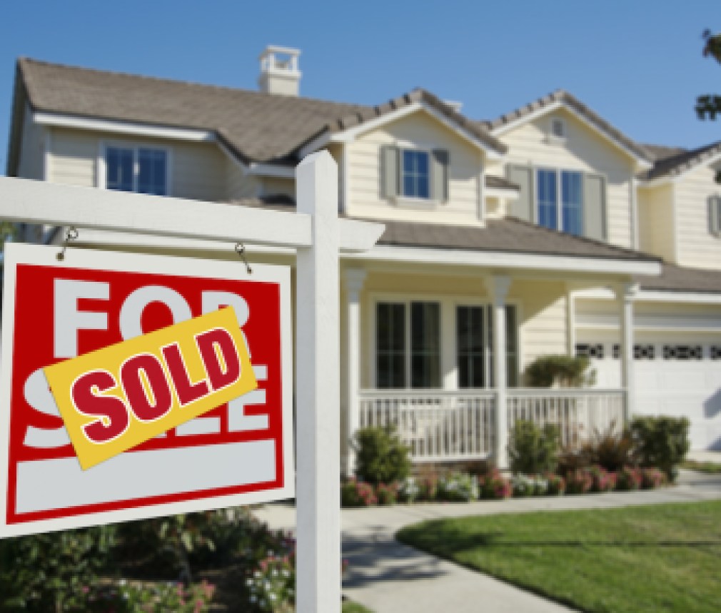 Sold Home For Sale Sign in Front of New House