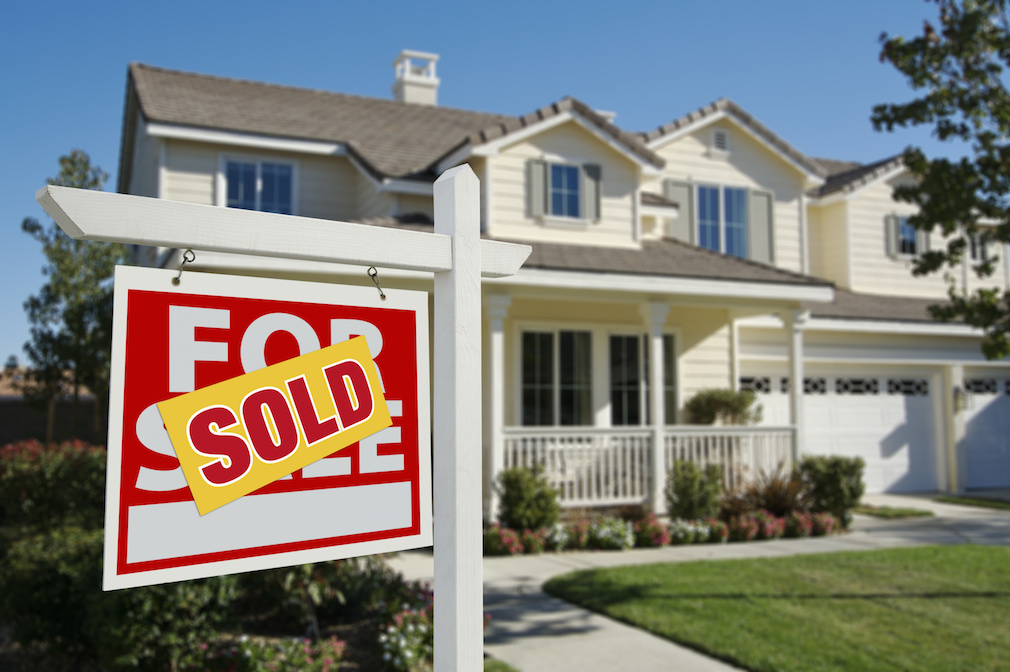 Sold Home For Sale Sign in Front of New House