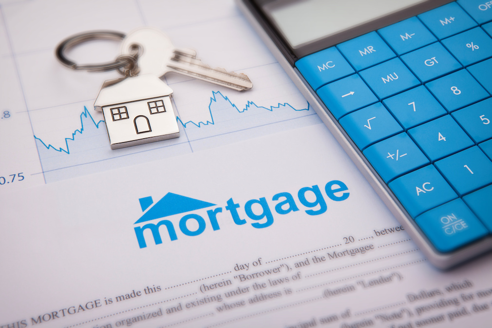 An empty mortgage application form with house key