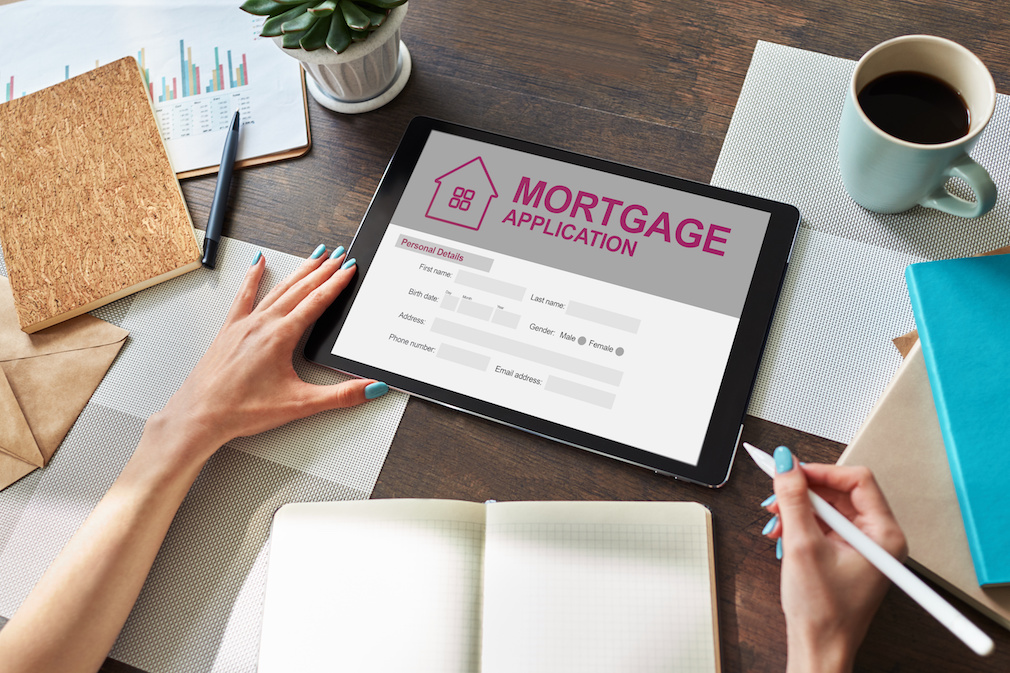 Online mortgage application on screen. Property loan. Business and financial concept.