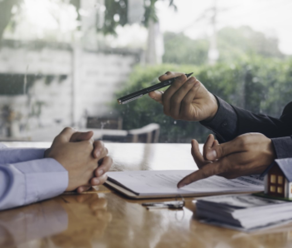 real estate agent holding house key to his client after signing contract,concept for real estate, moving home or renting property