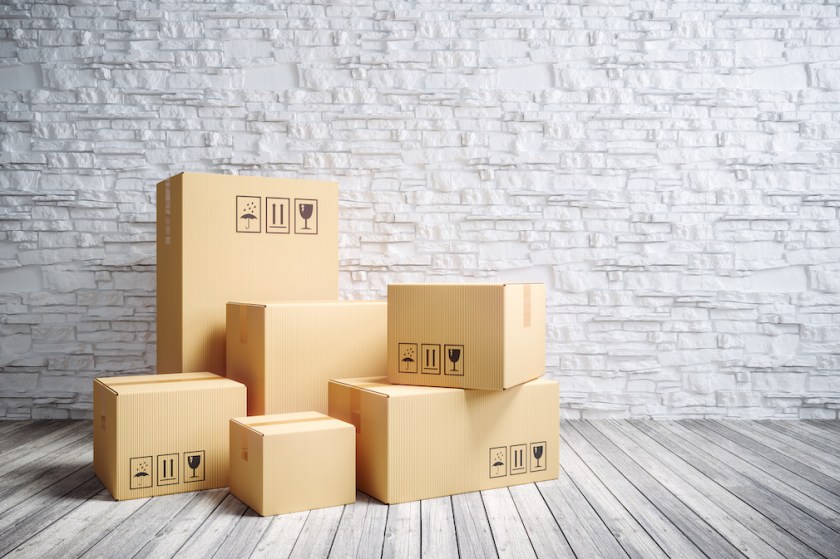 Cardboard moving boxes in new home.