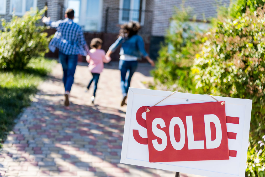 family running to new house