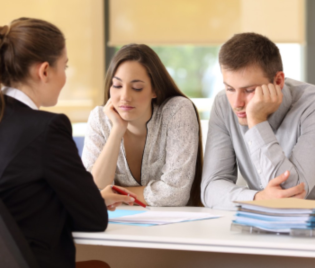 Bad saleswoman with unconvinced customers