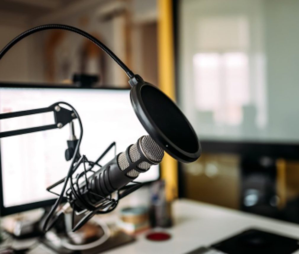 Podcast studio: microphone and computer.