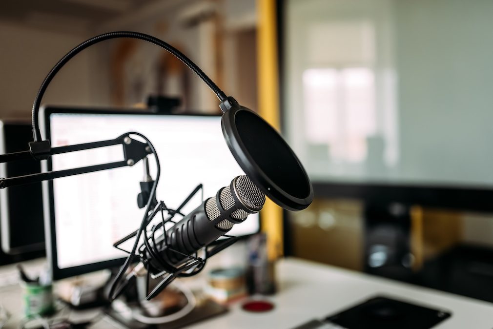 Podcast studio: microphone and computer.