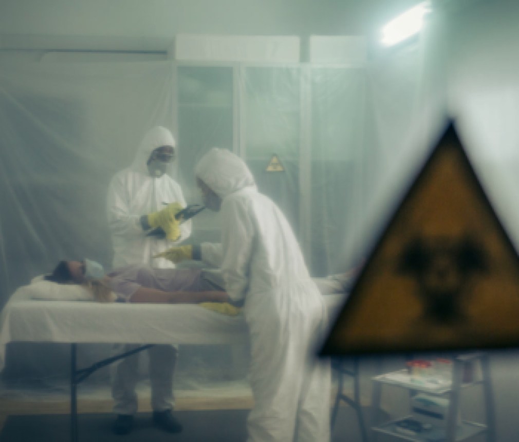 People attending to a woman with a virus lying on a stretcher