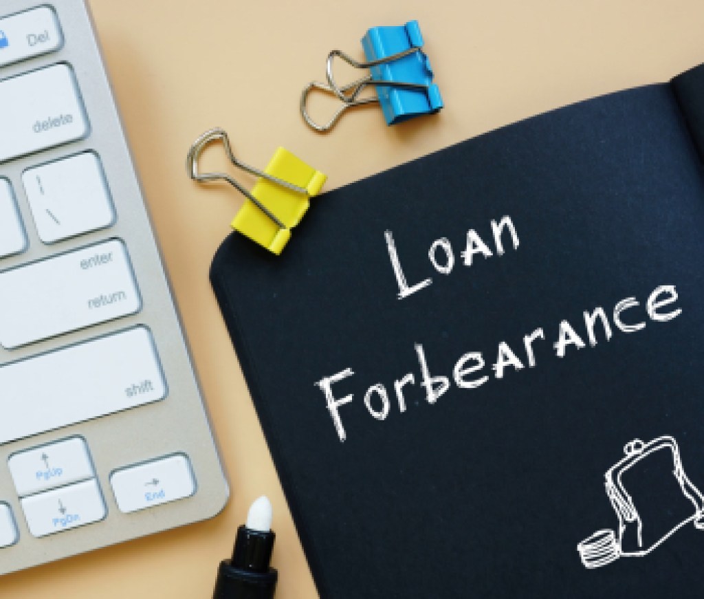 Business concept meaning Loan In Forbearance with sign on the page.