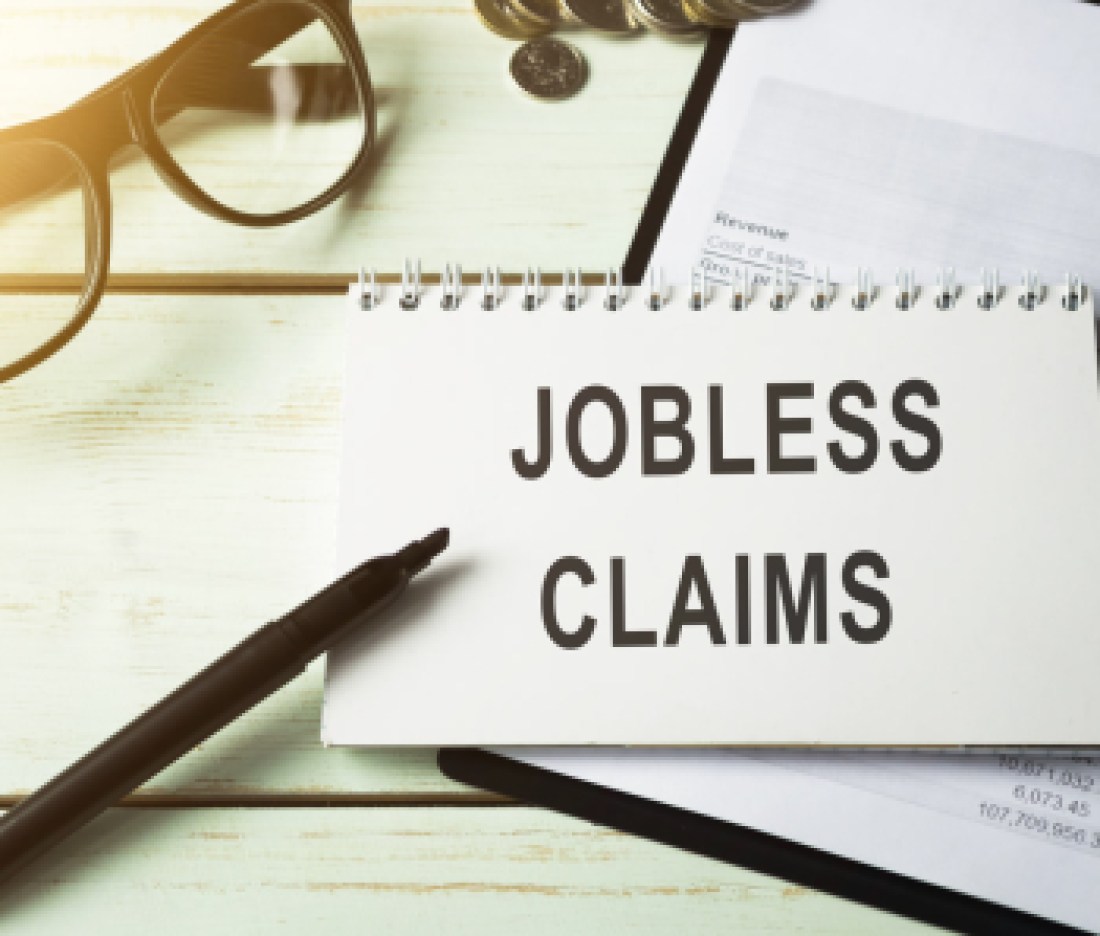 The phrase Jobless claims on a banner in hand. Human holds a cardboard with an inscription. Unemployment crisis. Economy crashed. Financial collapse. Recession. Finance. Employee