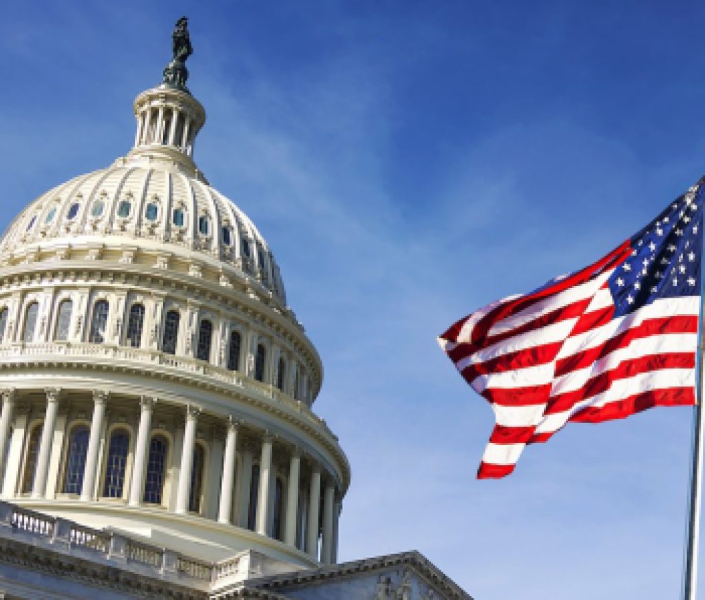 American flag waving with the Capitol Hill