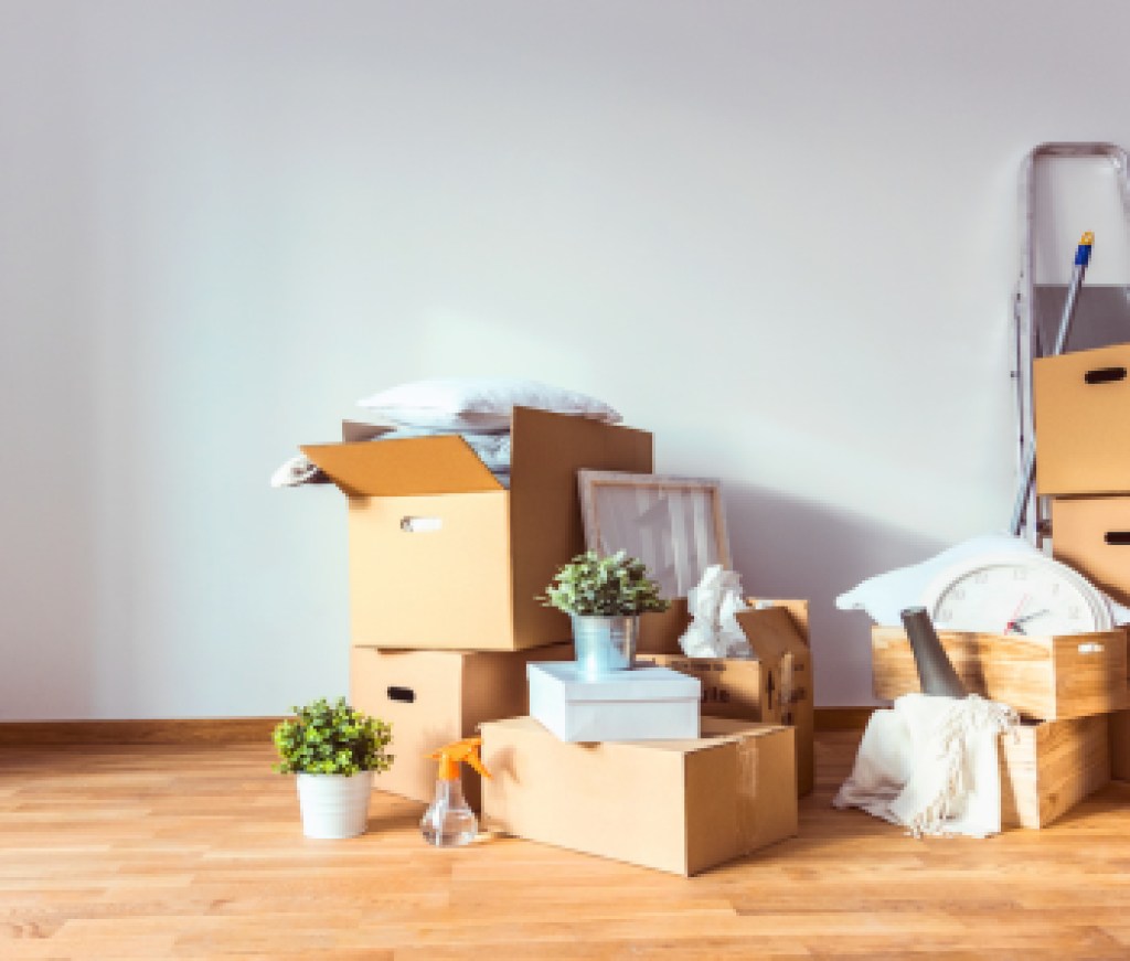 Move. Cardboard boxes and cleaning things for moving into a new home