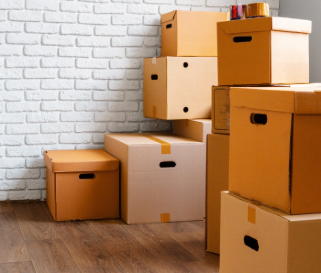 Close up of moving carton boxes in an empty room
