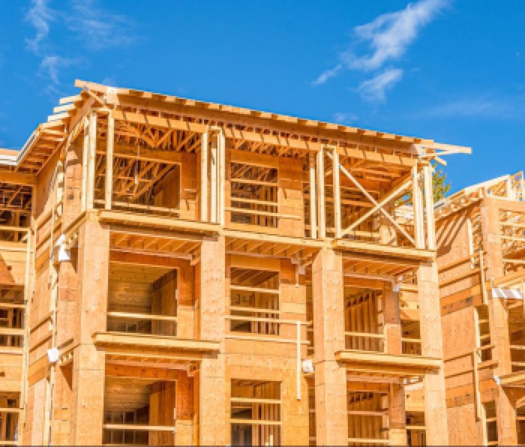 Apartment building under construction on sunny day