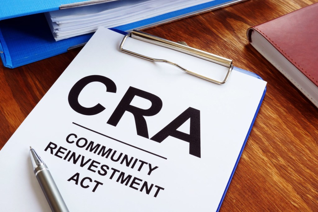 Community Reinvestment Act CRA in the blue clipboard.