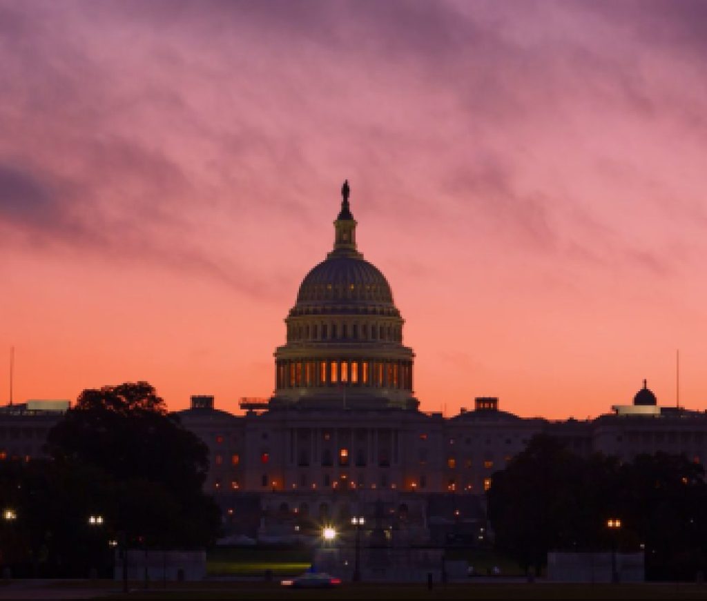 Alarmingly bright sunrise above US Capitol Dome. U.S. Capitol Dome Restoration project is nearing its completion.