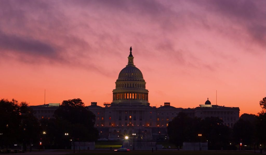 Alarmingly bright sunrise above US Capitol Dome. U.S. Capitol Dome Restoration project is nearing its completion.