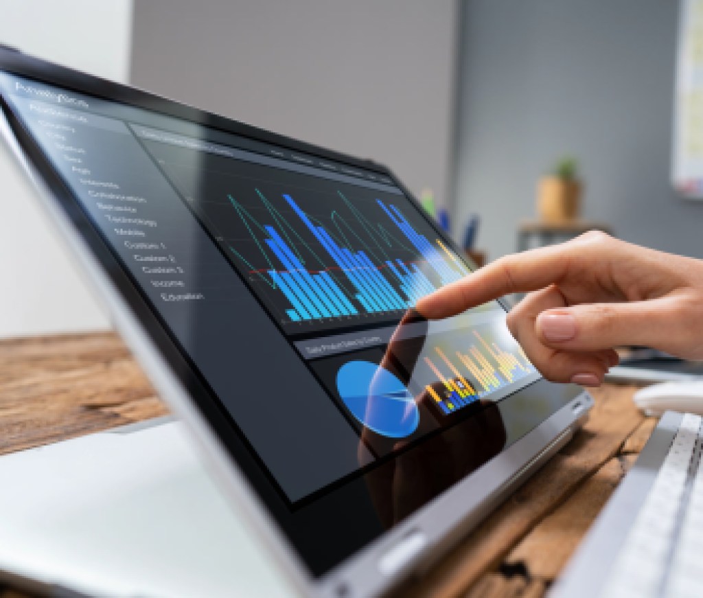 Businesswoman Analyzing Graph On Laptop