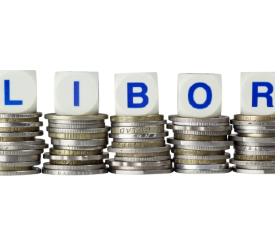 Stacks of coins with the letters LIBOR isolated on white