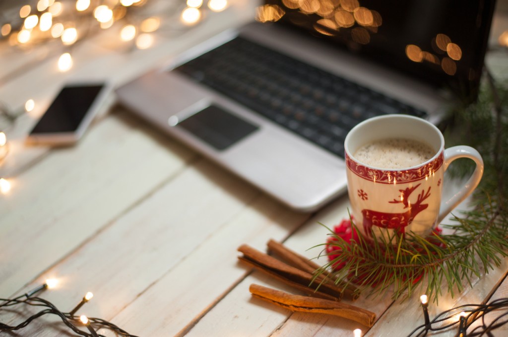 Freelancer's working place at home decorated for Christmas holiday