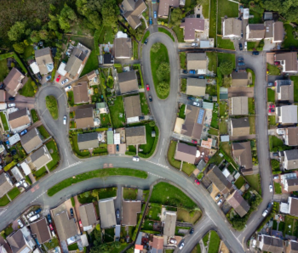 Top down aerial view of urban houses and streets in a residential area of a Welsh town