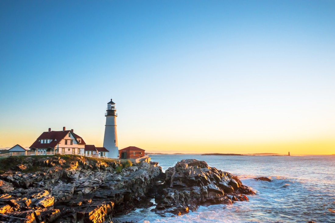 Portland Head Lighthouse at Fort Williams, Maine at sunrise over the Atlantic