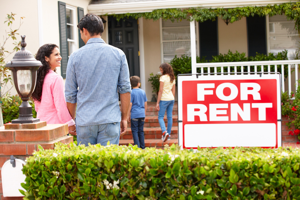 Hispanic family outside home for rent