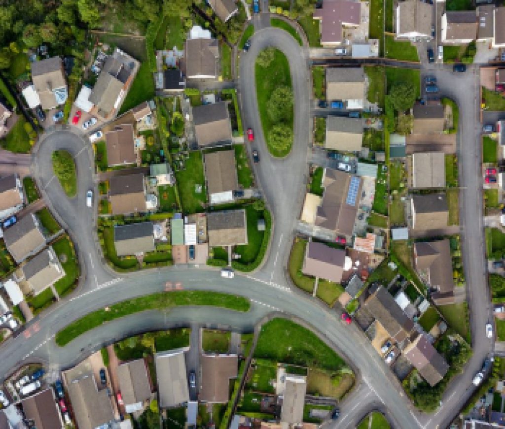 Top down aerial view of urban houses and streets in a residential area of a Welsh town