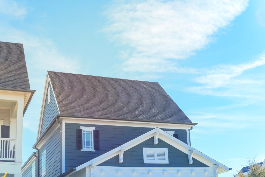 Blue wood siding on cottage style house near Dallas, Texas cloud