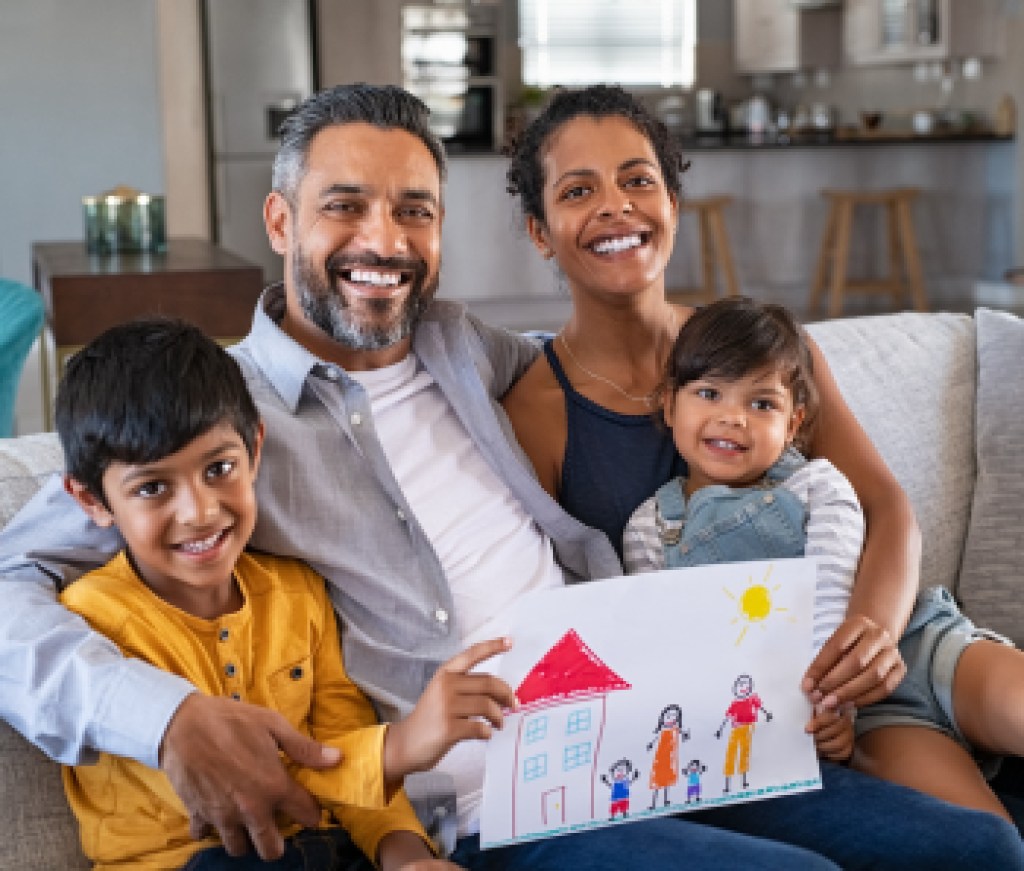 Happy ethnic family showing painting with new home