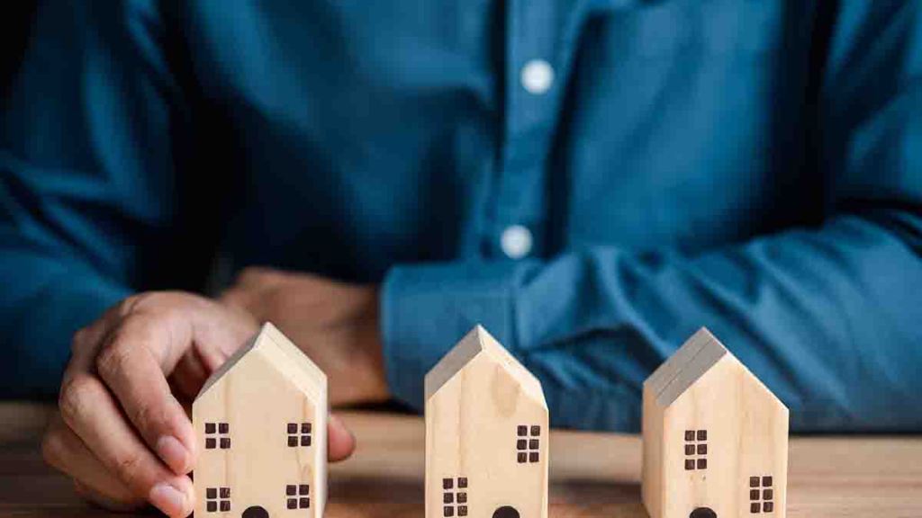 man-with-wooden-houses