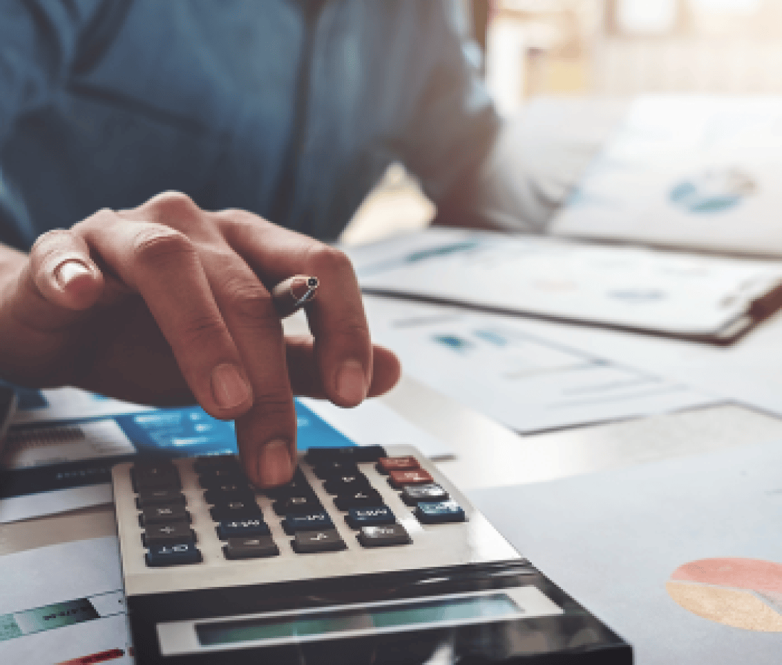 Home buyer calculating their budget on a calculator