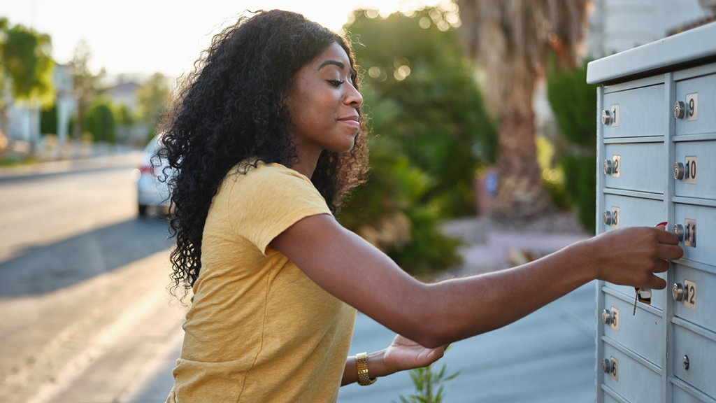 Woman picking up her mail