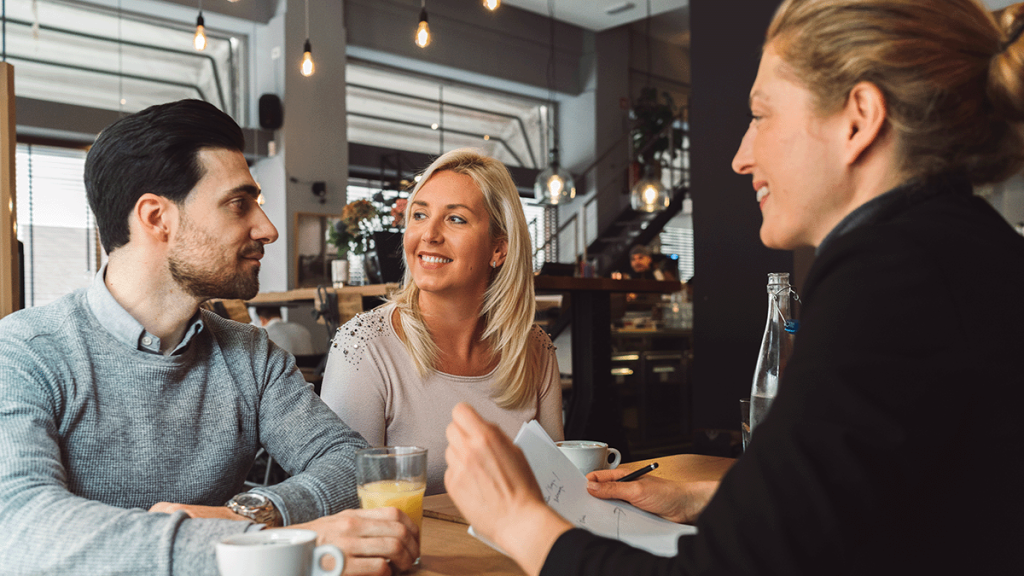 Couple and agent at listing appointment