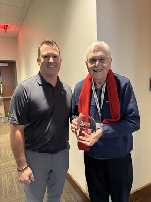 SVP of Fairway Reverse Lending, Josh Kilty (left), presents the Lifetime Achievement Award to “Pistol Pete” Stebbins (right).